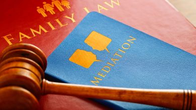 A family law mediation book and a court hammer representing family law solicitors role in mediation